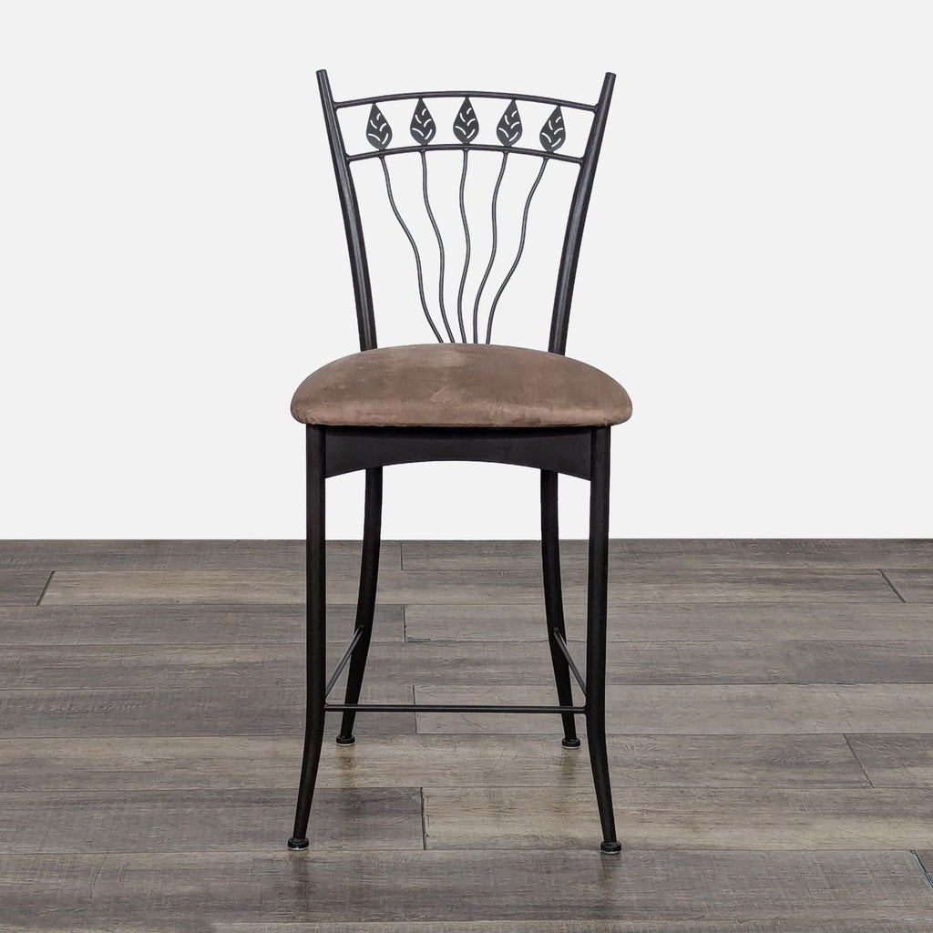 Elegant iron stool with leaf design and cushioned brown seat. Gibo Inc. Furniture.