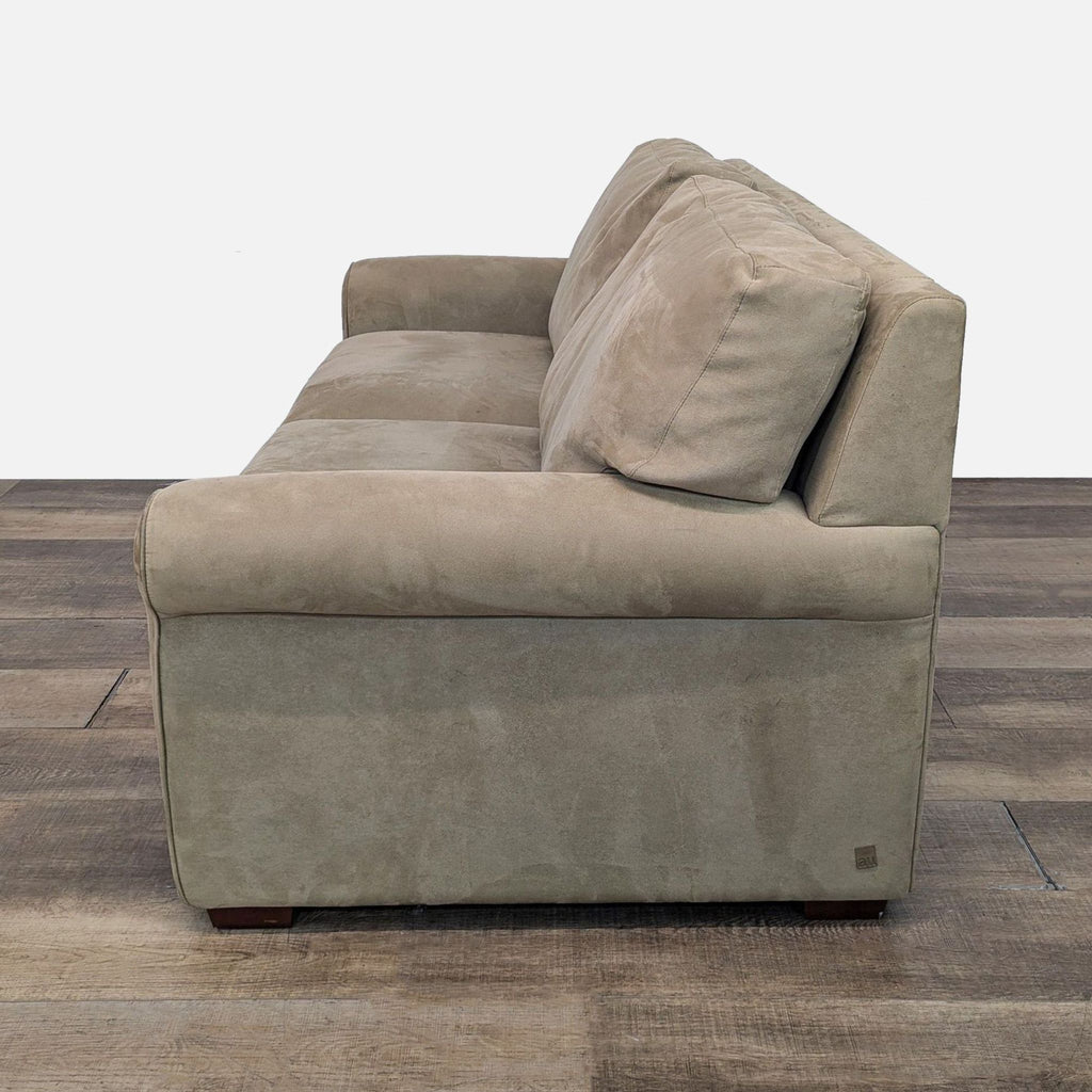 Side profile of fabric upholstered sleeper sofa.