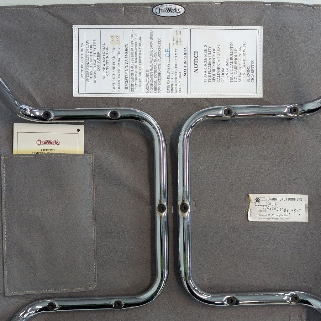 Underside of a chair showing metal framework and labels.