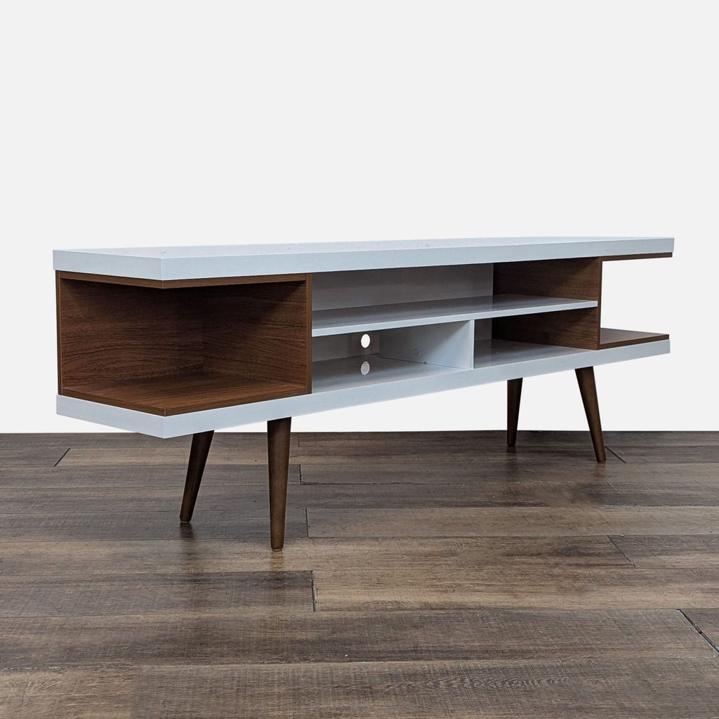 Wood entertainment center with open shelves and tapered legs.