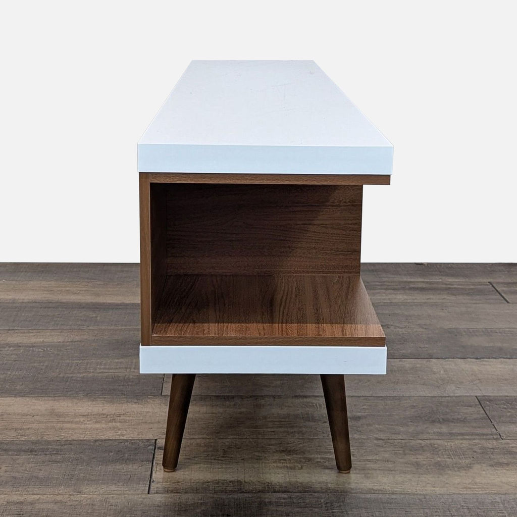 Side view of an engineered wood entertainment center by Wade Logan.