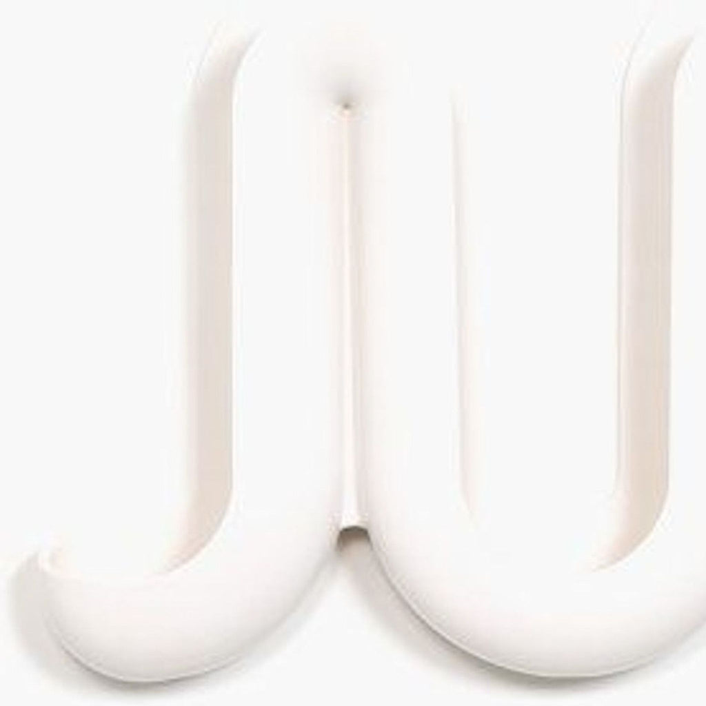 Close-up of the Swell Wall Catchall's sculpted design, designed for organizing coats and keys.