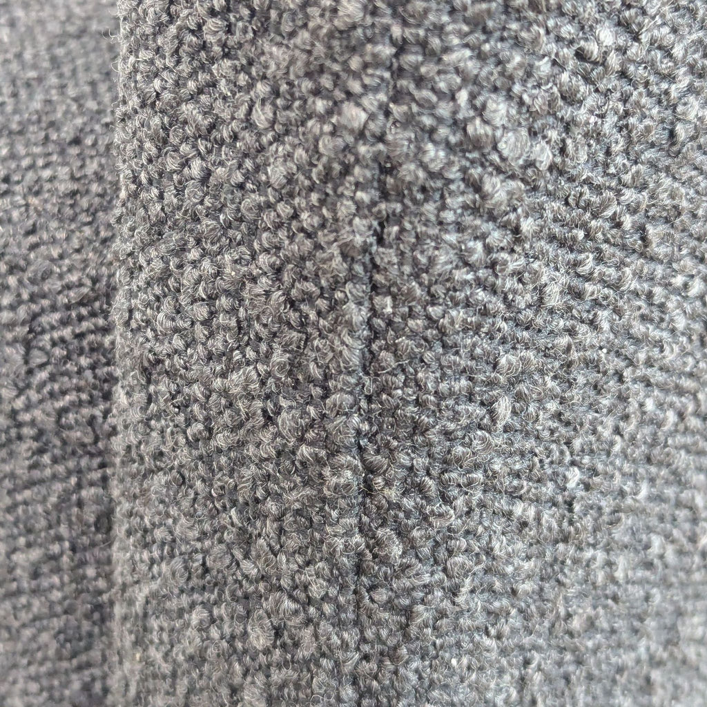Close-up of the boucle fabric texture on a dining chair by CB2.