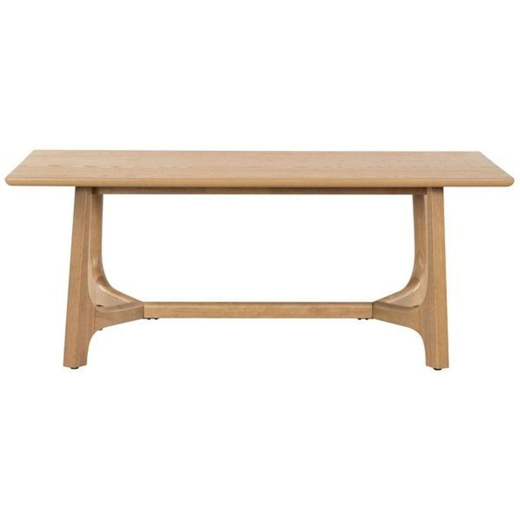 Safavieh dining table with V-shaped trestle base in natural oak veneer finish.