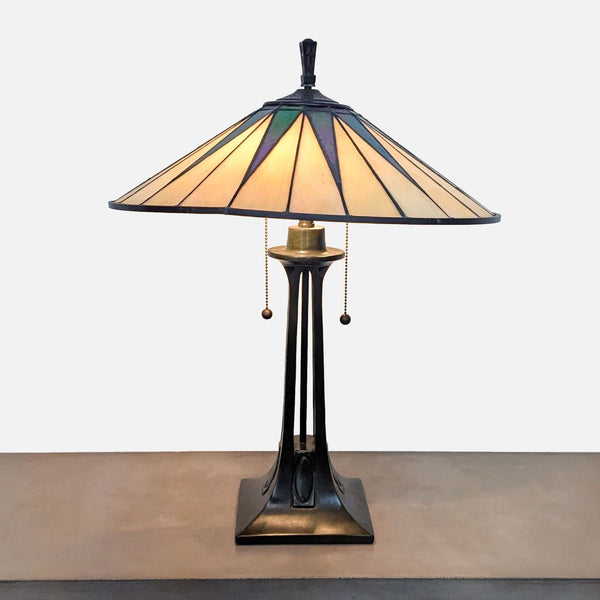 Thomasville lamp with triangular art glass shade in ebony and yellow hues.