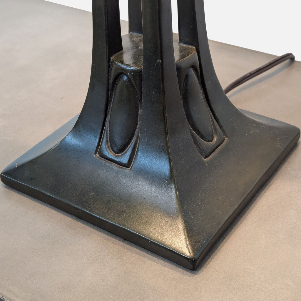 Close-up of the lamp's detailed black base.