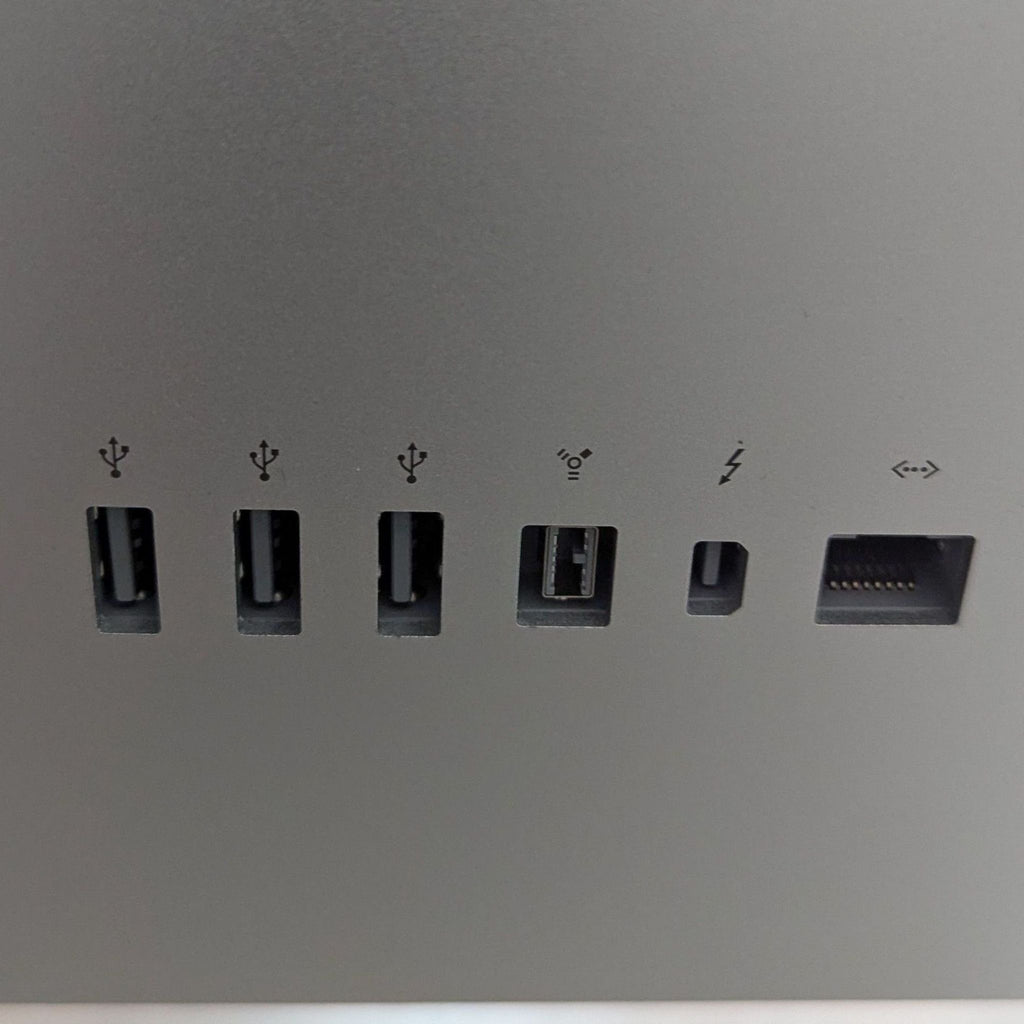 Close-up of multiple ports on the Apple LED Cinema Display for device connection.