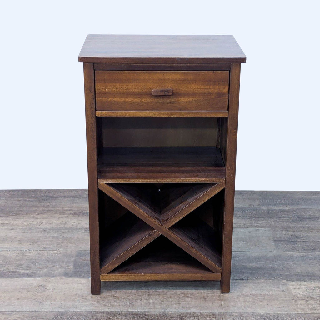 Dark wooden furniture with drawer and X-shaped shelf on wood floor.