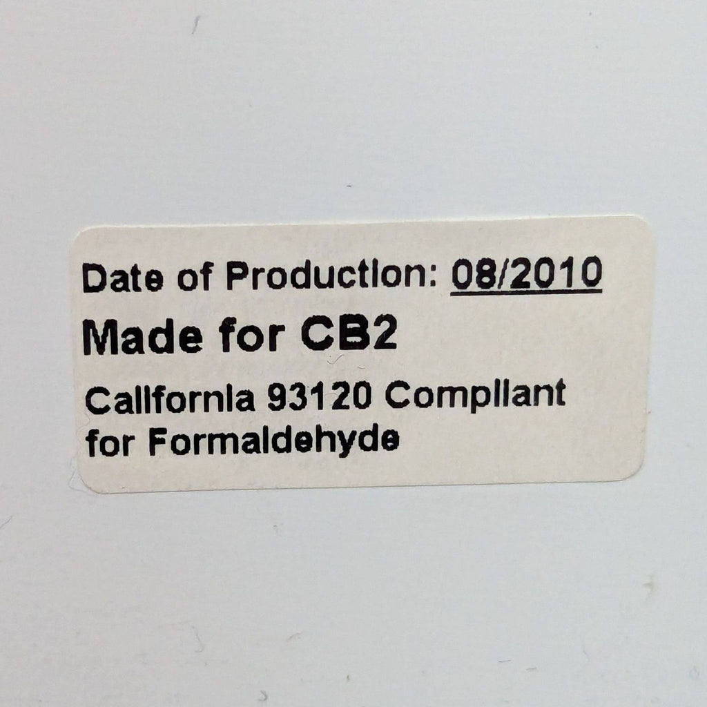 Label stating production date as 08/2010 and compliance for CB2.