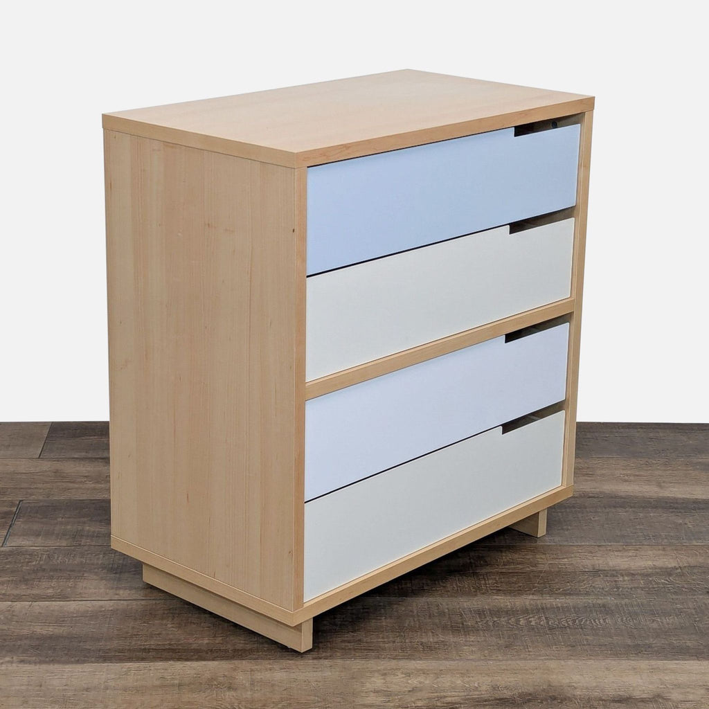 Angled view of Blu Dot dresser, highlighting the maple veneer and colored drawer fronts.