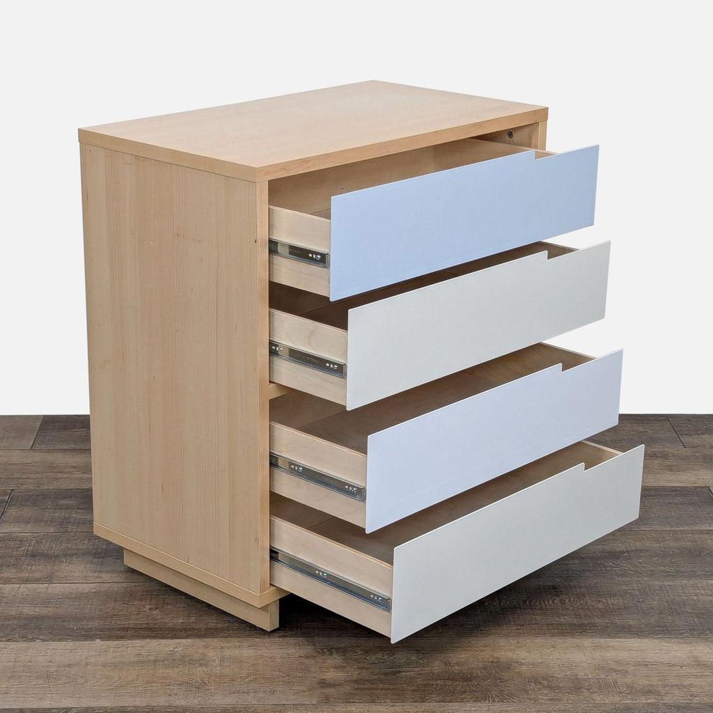 Side view of Blu Dot dresser, showing open self-close drawers and maple veneer.