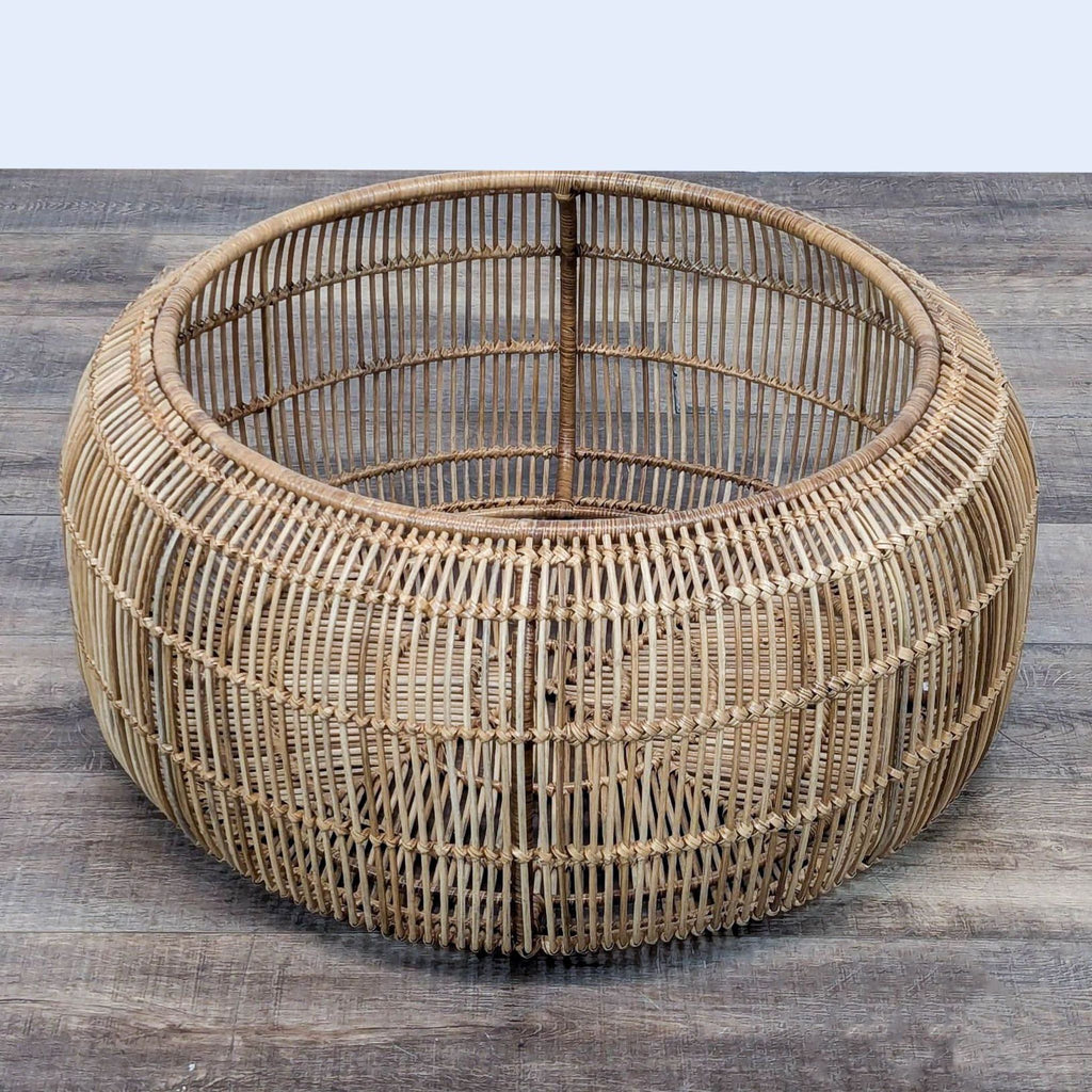 Round wicker coffee table by Lulu and Georgia with airy, organic style.  