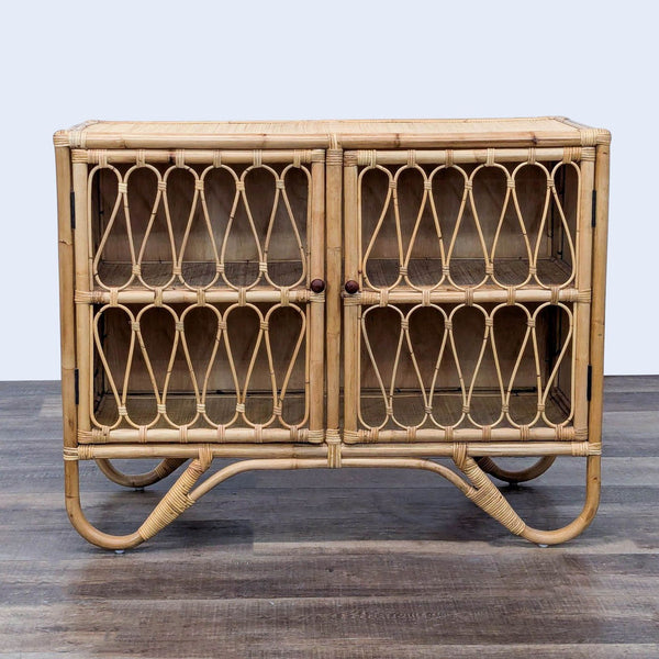 Vintage-style rattan cabinet with loop panes and two shelves.