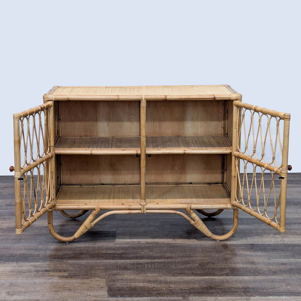 Boho rattan cabinet with open doors showing two interior shelves.