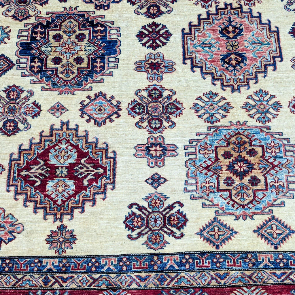 Detailed geometric designs on a Reperch wool rug with short pile.