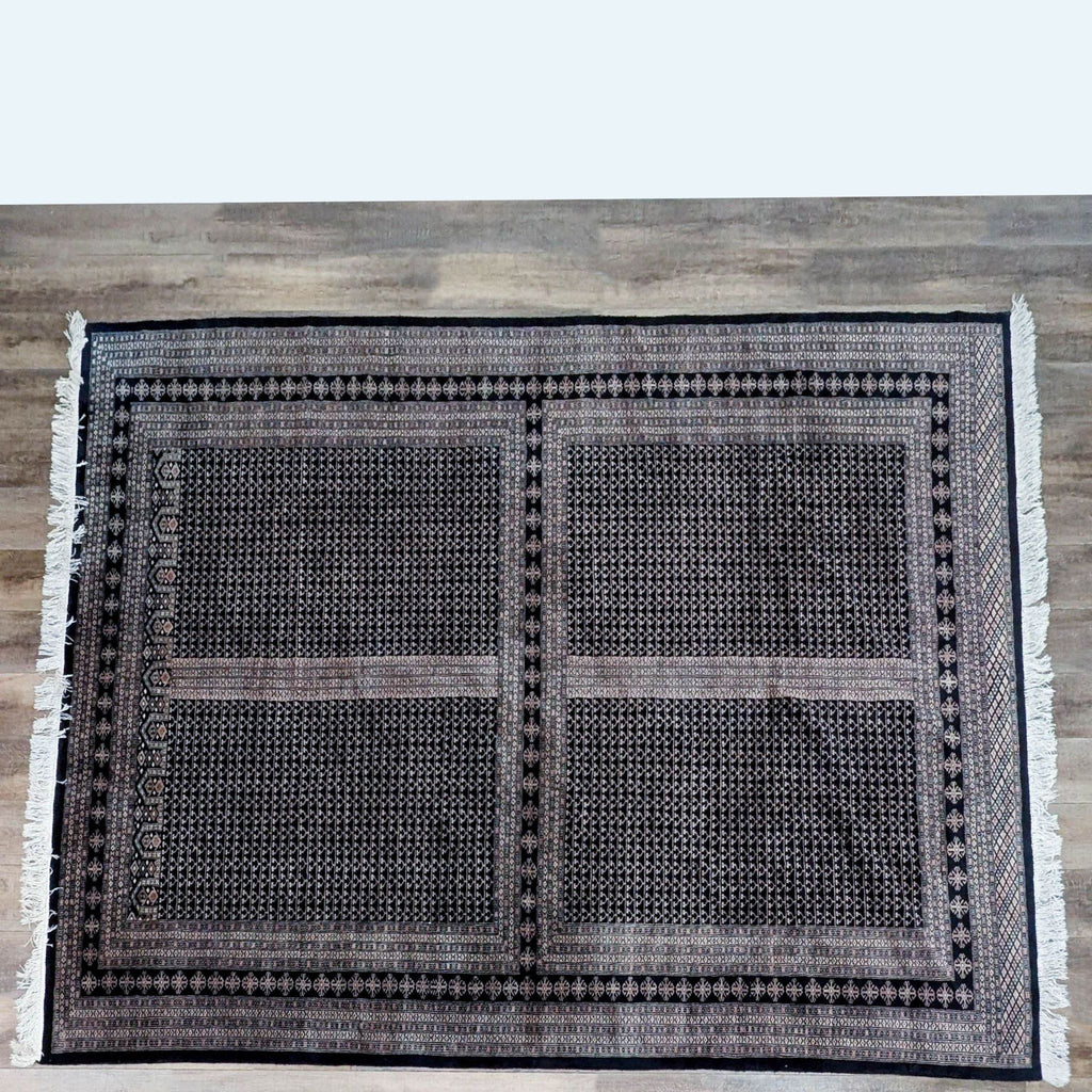 Full view of a patterned Reperch wool rug on the floor.
