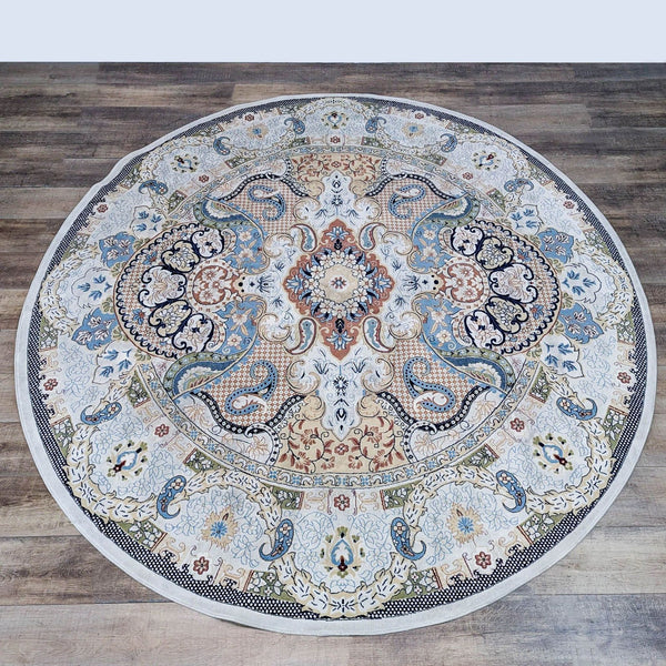 Round Turkish rug with intricate floral patterns in blue, ivory, and beige from Unique Loom.