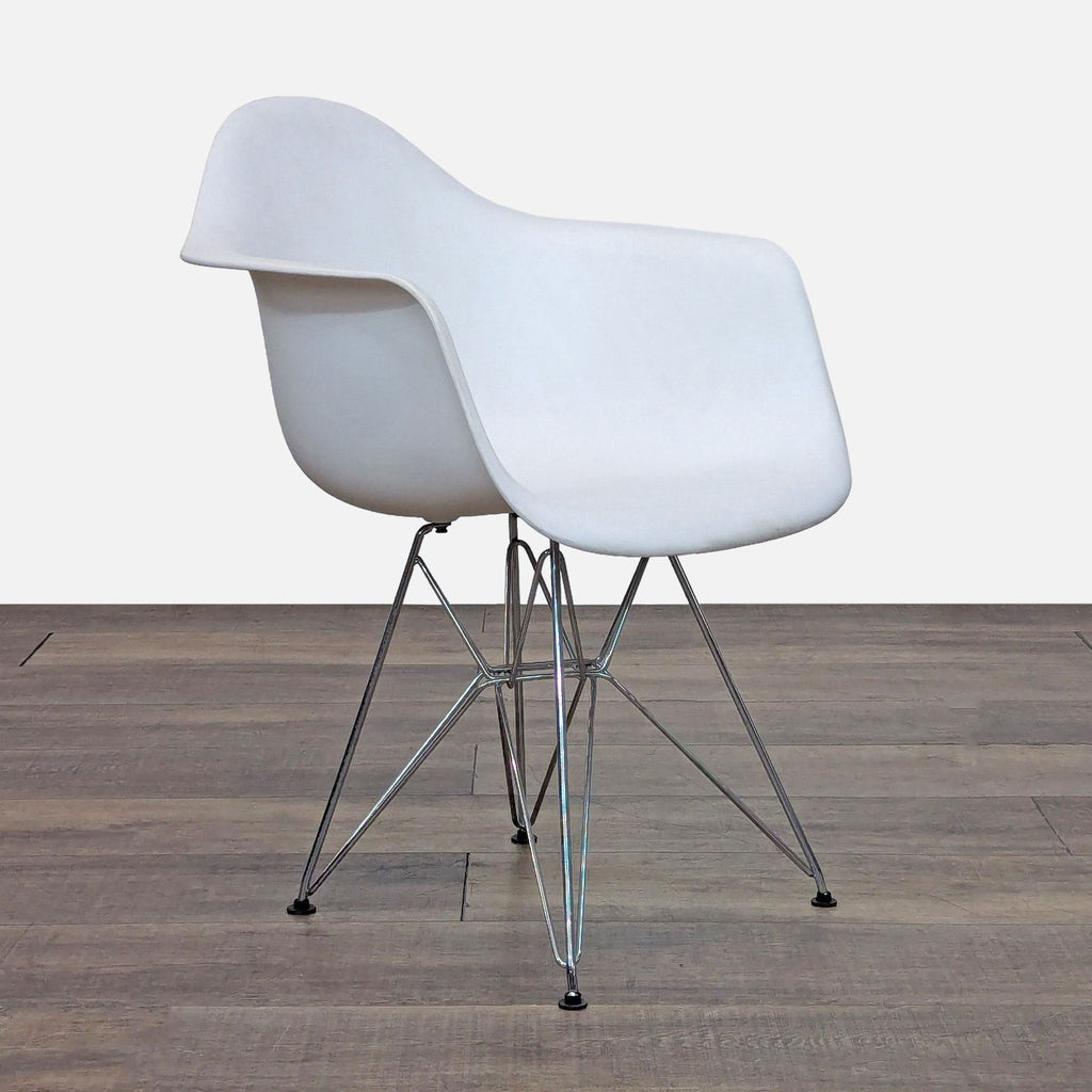 Angled view of a contemporary chair with a minimalist plastic design and wire base.