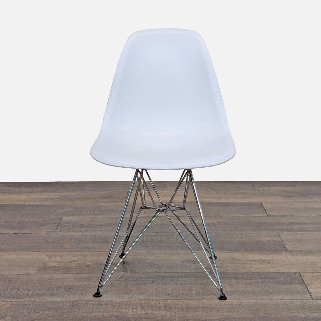 Front view of a white Reperch dining chair with metal legs.