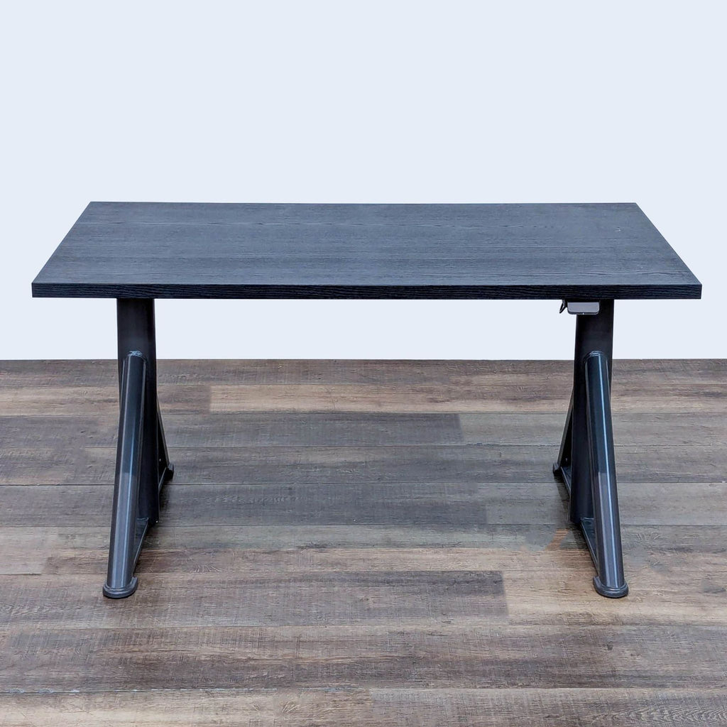 Modern desk with stain-resistant surface, great for sitting or standing work.