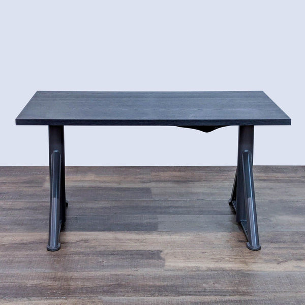 Adjustable height desk with cable management and durable veneer surface.