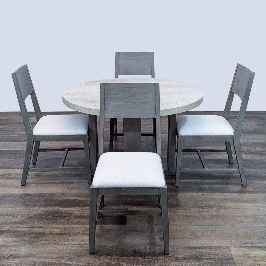 Dining set with concrete laminate top and upholstered chairs, featuring a rustic, natural look.