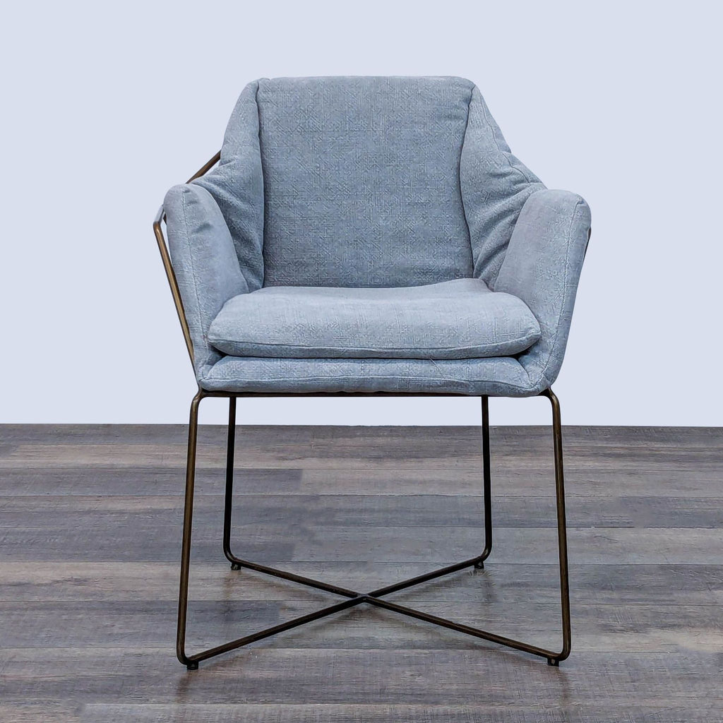 Lounge chair with metal frame and soft cushions, front view.