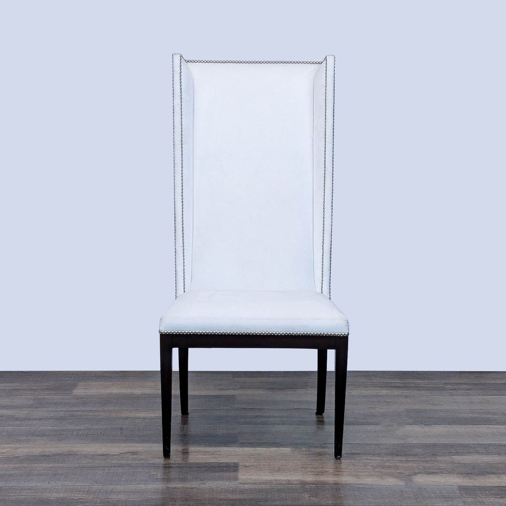 Reperch dining chair with a high backrest and white upholstery.