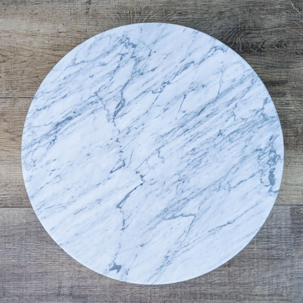 Top view of a Carrara marble table showcasing its smooth, elegant surface.