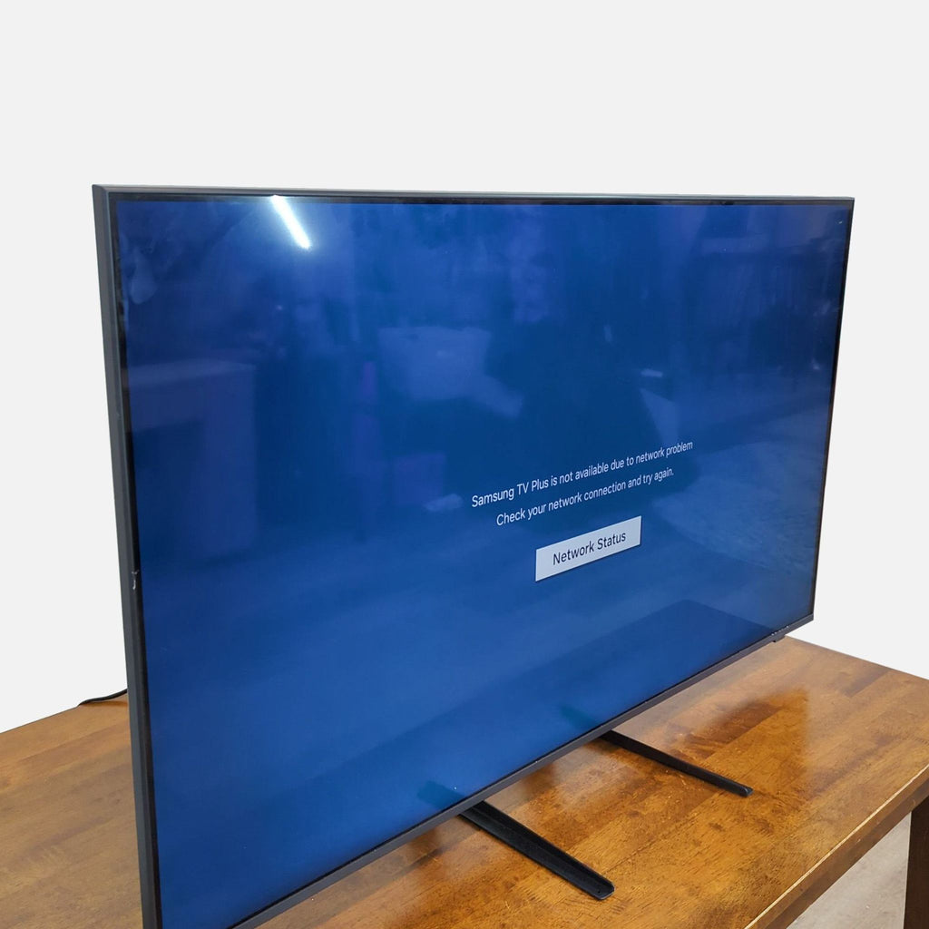 Side view of a Samsung 55" TV showing a network error message on its screen.