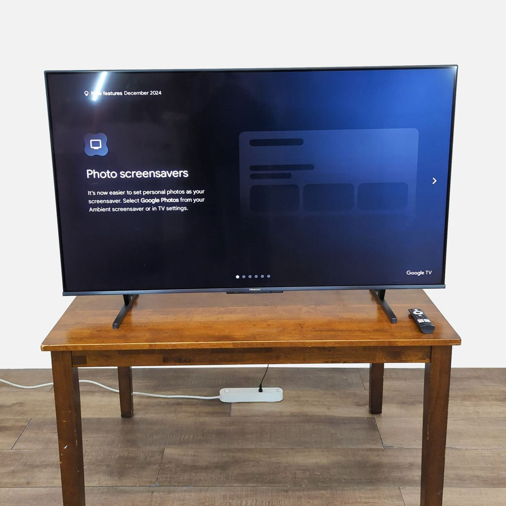 Hisense 55" U8 Mini-LED 4K UHD TV on wooden table, displaying Google TV interface.