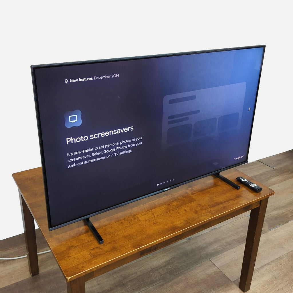 Side view of Hisense 55" Mini-LED TV on table, showing Google TV's screensaver feature.