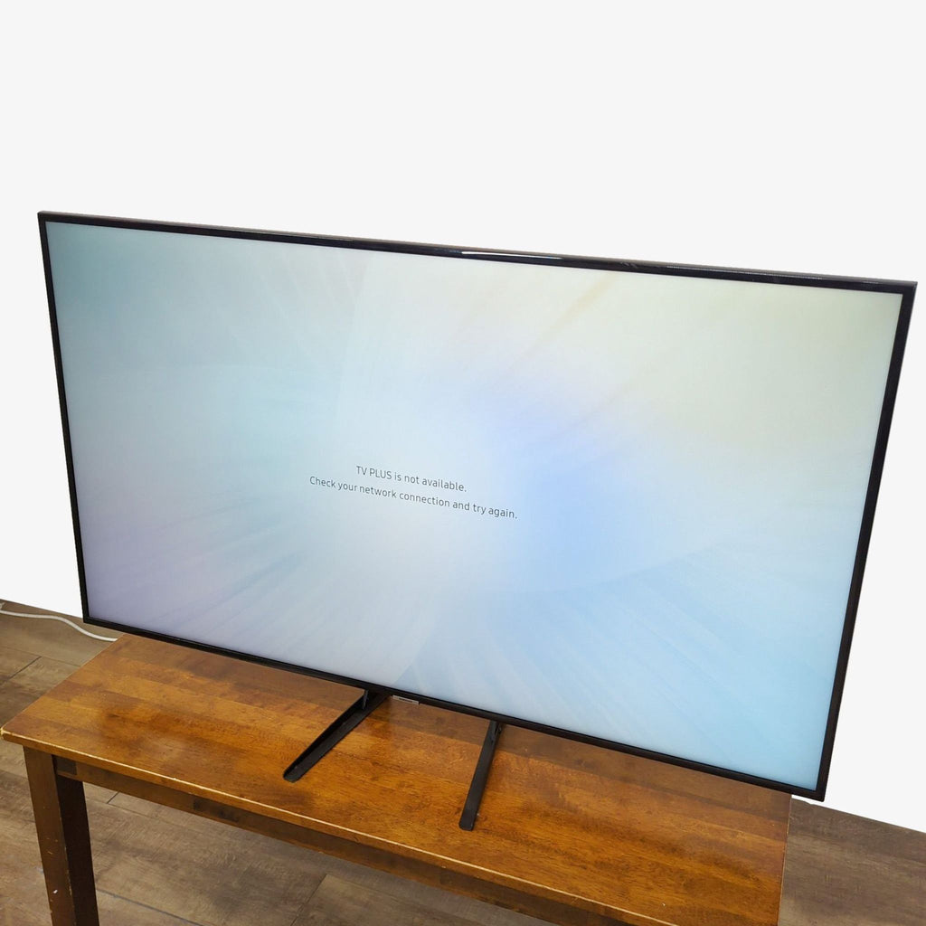 Side-angle view of a Samsung 55-inch TV displaying a network connection message.