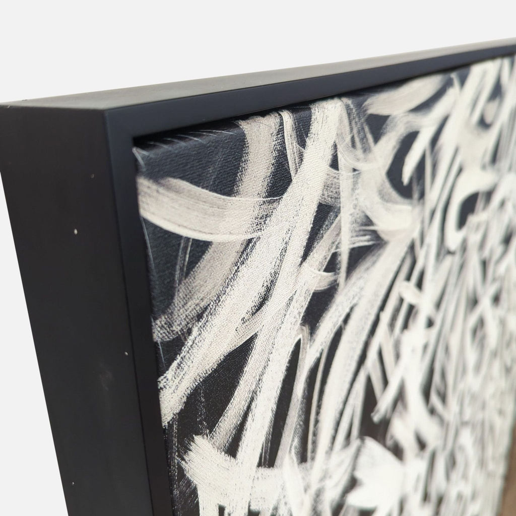 Close-up of abstract canvas with a detailed black frame edge.