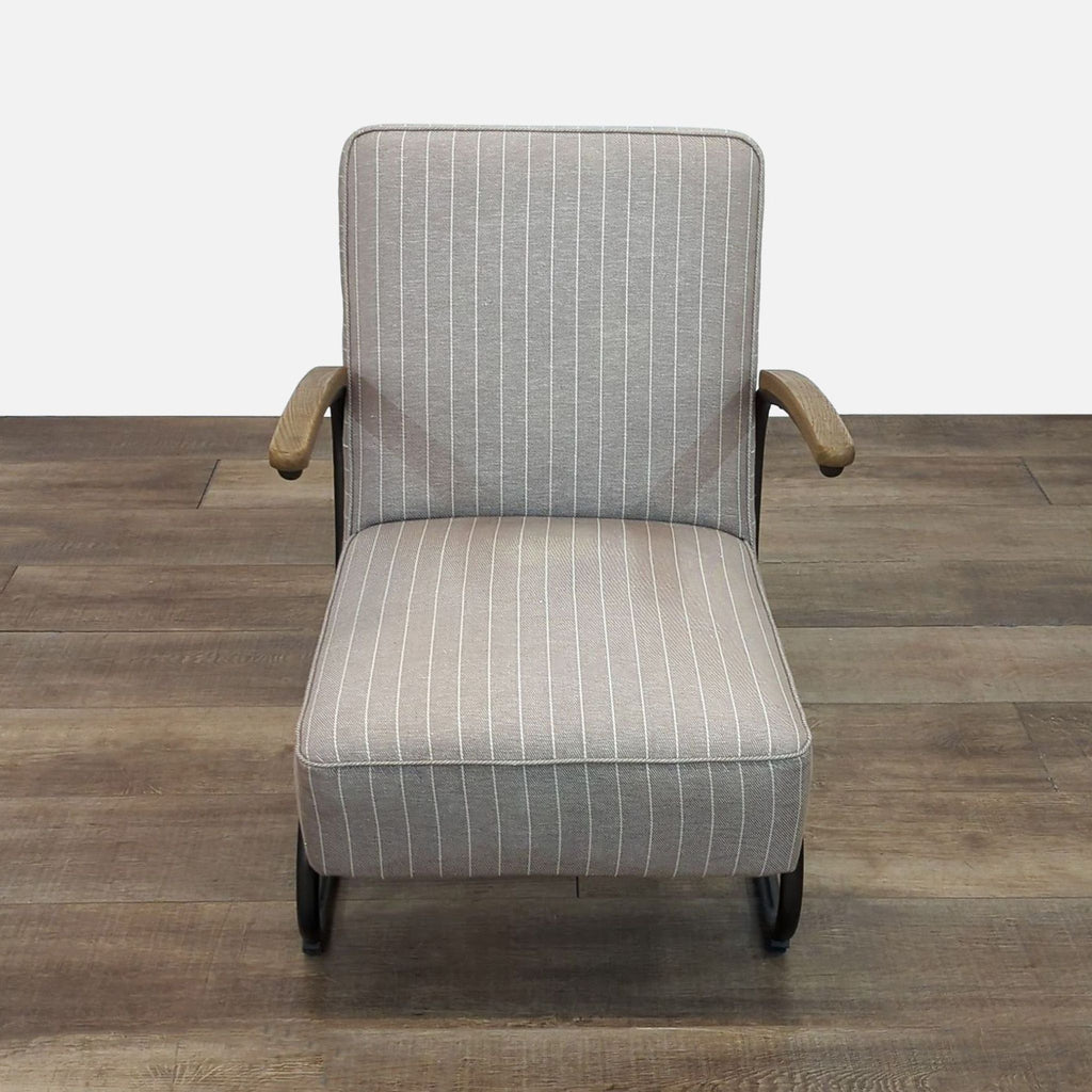 Front view of a lounge chair with pinstripe fabric and oak arm rests.