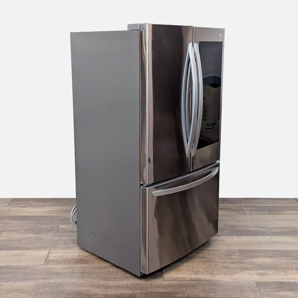 Side view of an LG stainless steel refrigerator with French doors and bottom freezer.