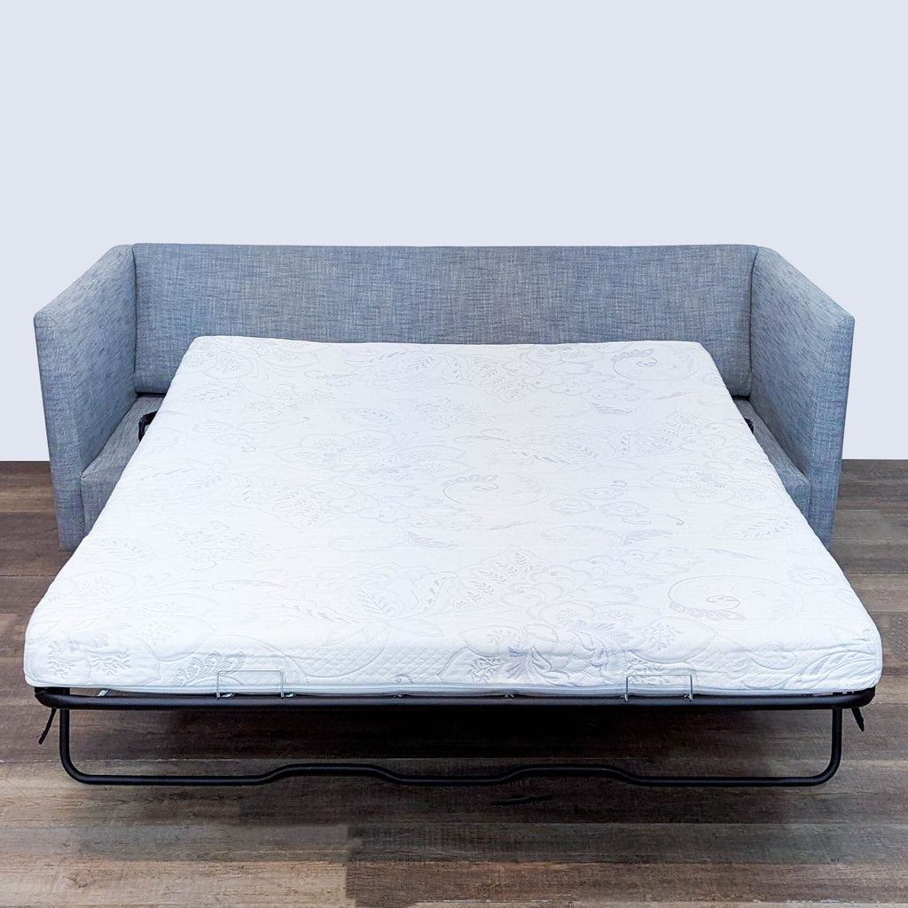 West Elm sleeper sofa with pull-out memory foam mattress.