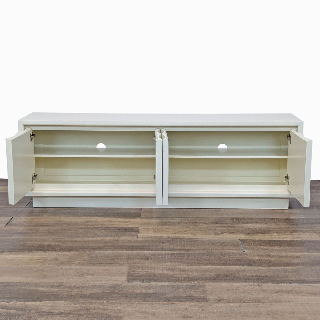 Open view of the Ivory Lacquer Entertainment Center showing spacious storage shelves and back cutouts.