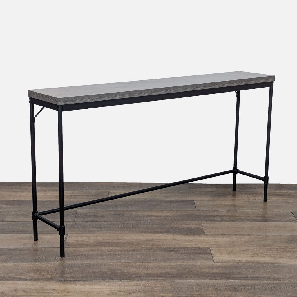 Slim console table with a grey wooden top and durable metal legs.
