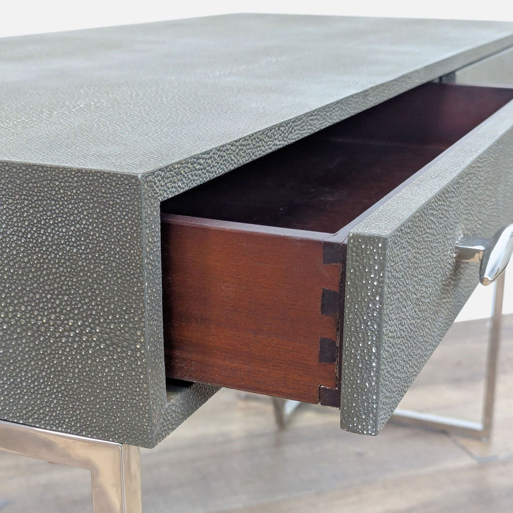 Close-up of Reperch desk drawer detail with intricate texture.