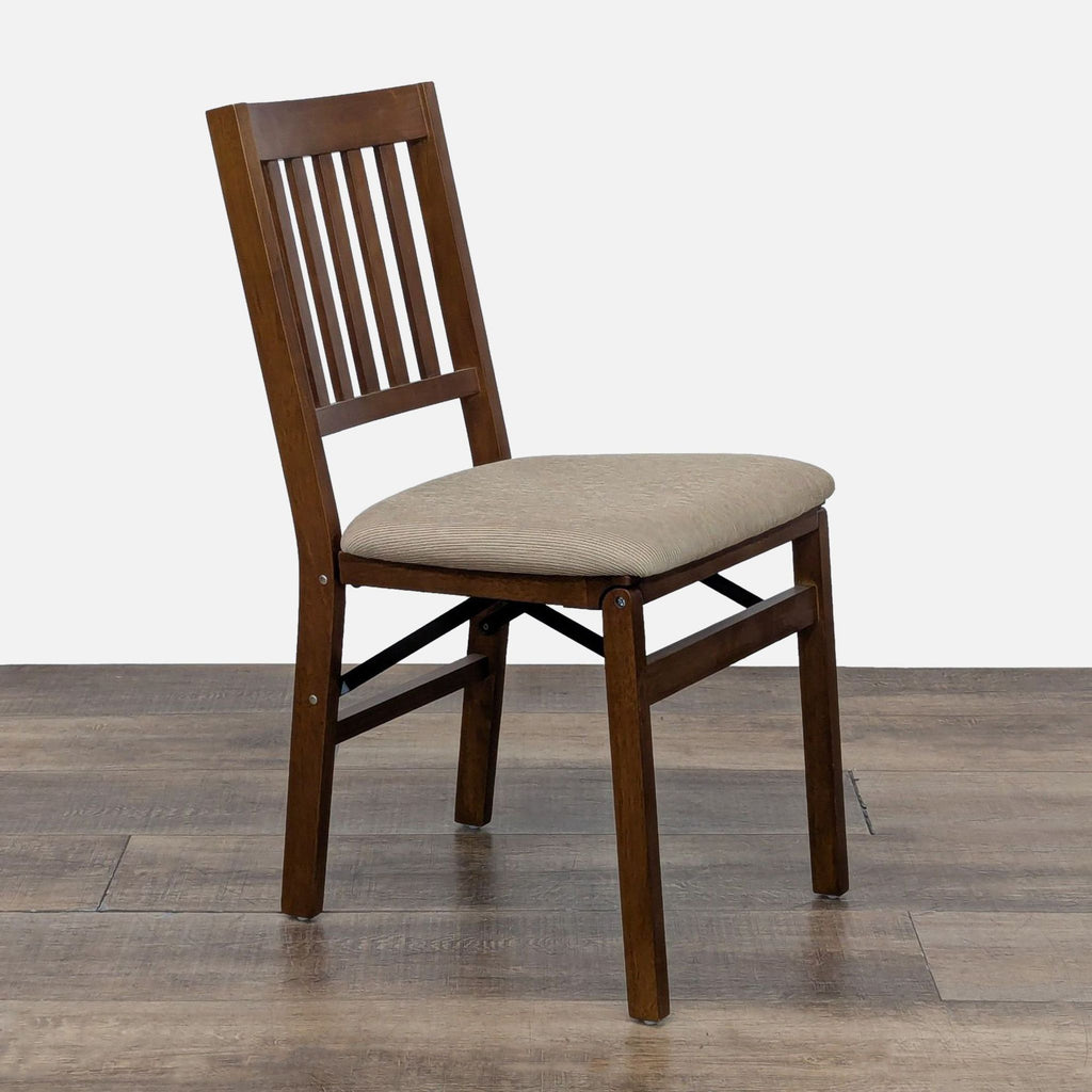 Angled view of Reperch dining chair highlighting its wooden finish and classic design.