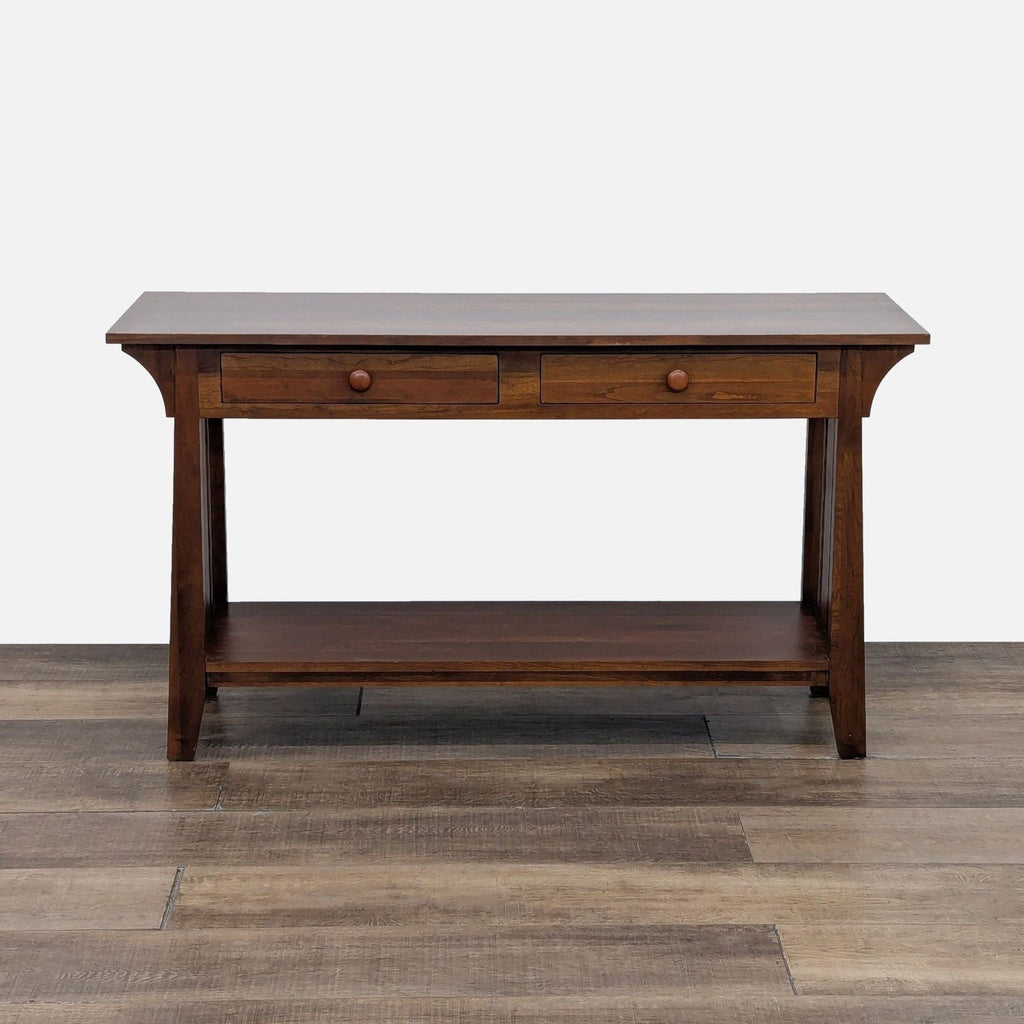 Wooden console table with two drawers and a lower shelf.