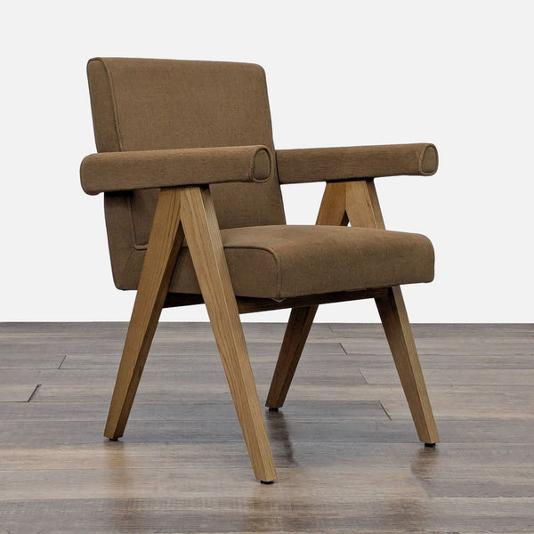 Mid-century modern dining chair with oak frame and padded upholstery.