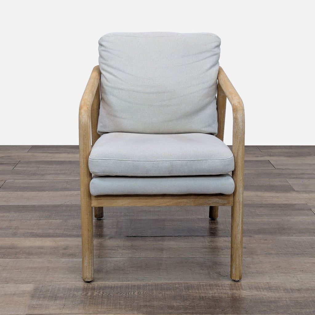 1. Lounge chair with sturdy wood frame, high armrests, and double padding. Threshold brand.