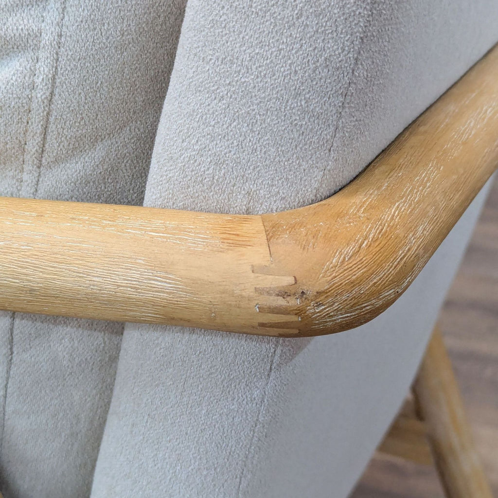 3. Detail of chair's wood construction and cushioned back. Threshold lounge category.