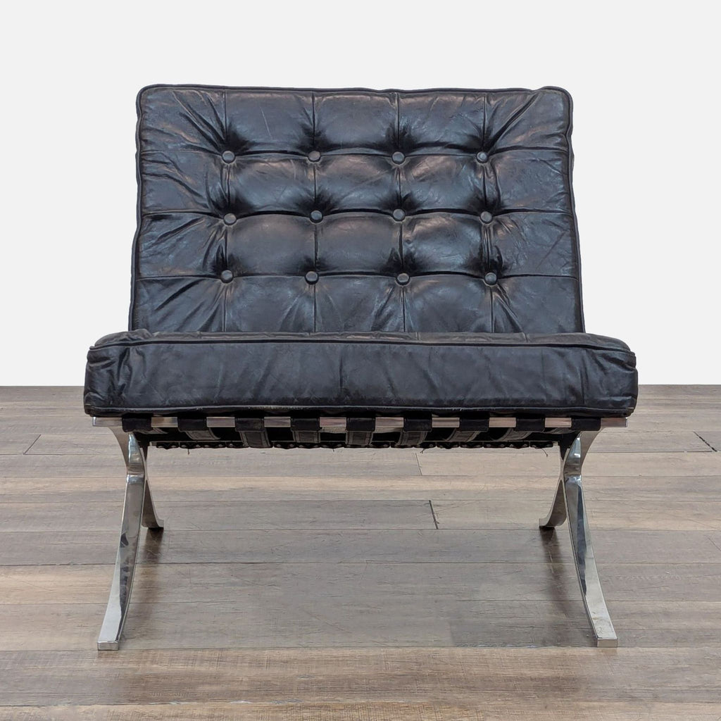 Replica Barcelona chair with tufted leather cushions and stainless steel frame, front view.