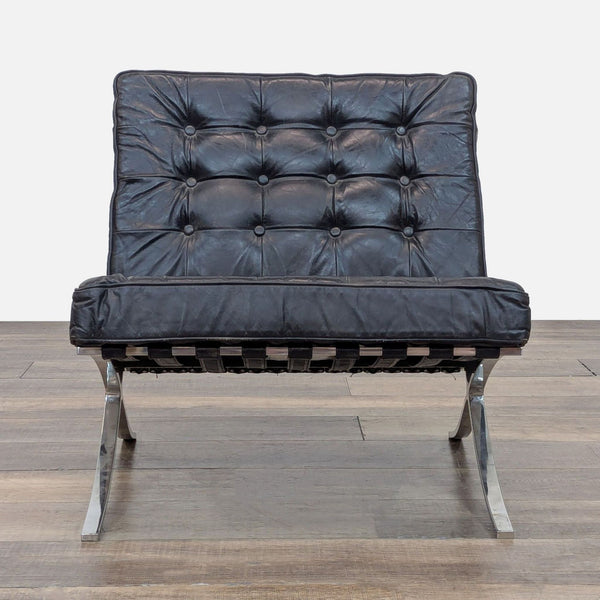 Replica Barcelona chair with tufted leather cushions and stainless steel frame, front view.
