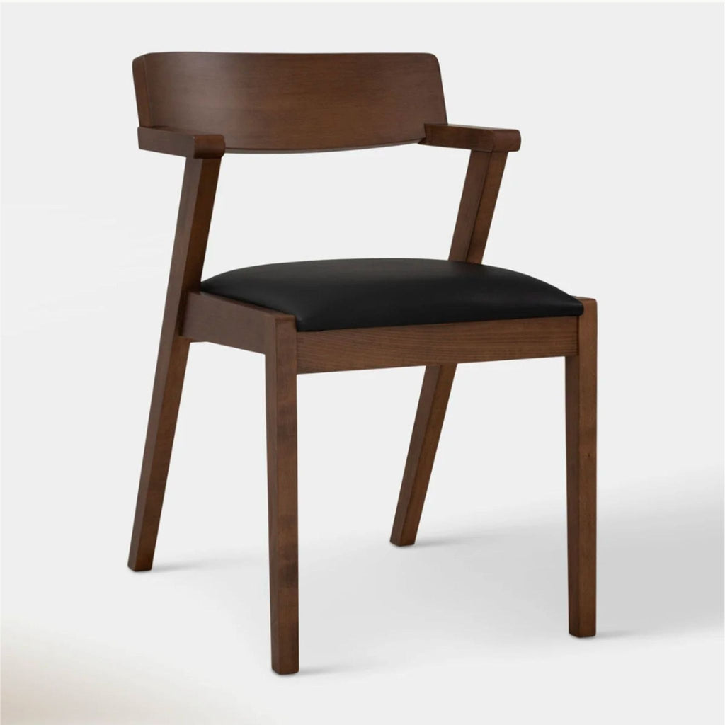 Stylish dining chair with sleek, angular design and padded leather seat by Article.