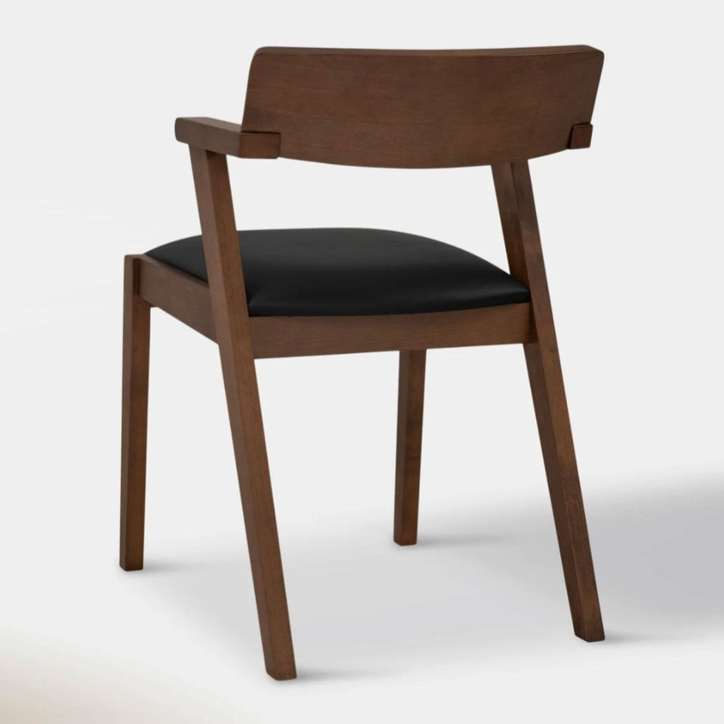 Back view of Article's Zola dining chair showcasing angular legs and smooth wood finish.