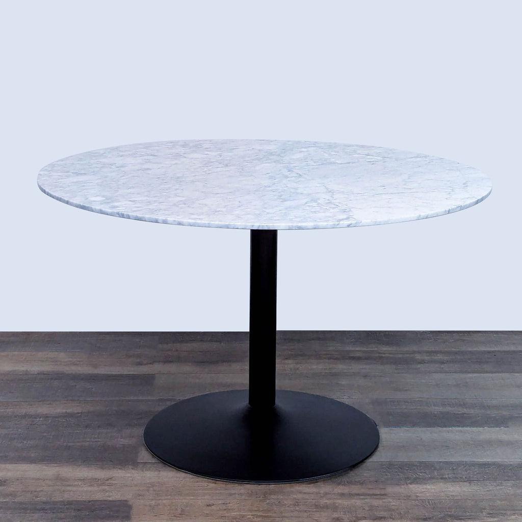 Elegant dining table featuring Italian white marble surface and matte black base.